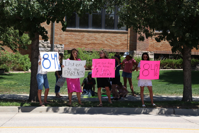 Douglas County parents rally on July 31, 2020, to reopen schools for 100% in-person learning.